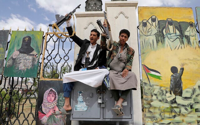 Houthi supporters chant slogans in front of banners supporting Palestinians, during anti-US and anti-Israel rally in Sanaa, Yemen, April 25, 2025. (AP Photo/Osamah Abdulrahman)