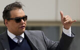 Former US Rep. George Santos leaves federal court after being sentenced to more than seven years in prison for fraud and identity theft, Friday, April 25, 2025, in Central Islip, N.Y. (AP Photo/Julia Demaree Nikhinson)