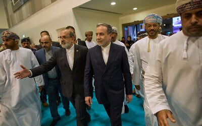 Iranian Foreign Minister Abbas Araghchi, center, visits the Muscat International Book Fair in Oman, April 25, 2025. (Fatima Shbair/AP)