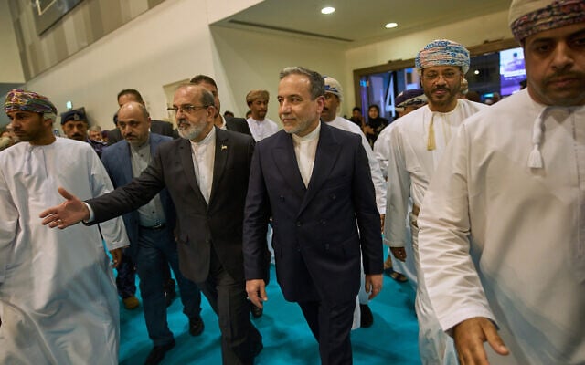 Iranian Foreign Minister Abbas Araghchi, center, visits the Muscat International Book Fair in Oman, April 25, 2025. (Fatima Shbair/AP)