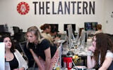 Emma Wozniak, editor in chief of the Ohio State University's The Lantern newspaper, talks with Nora Igelnik, campus editor at the paper's office in Columbus, Ohio, April 24, 2025, as managing editor of content, Lucy Lawler listens. (AP Photo/Joe Maiorana)