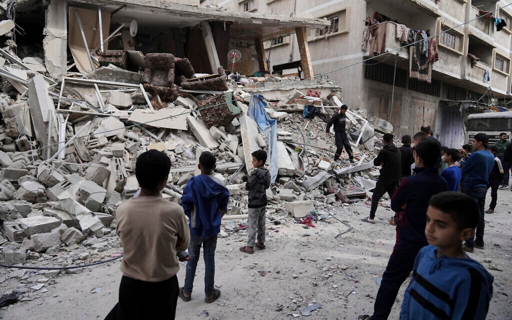 Palestinians inspect the damage after an Israeli airstrike in Gaza City, April 26, 2025. (AP Photo/Jehad Alshrafi)