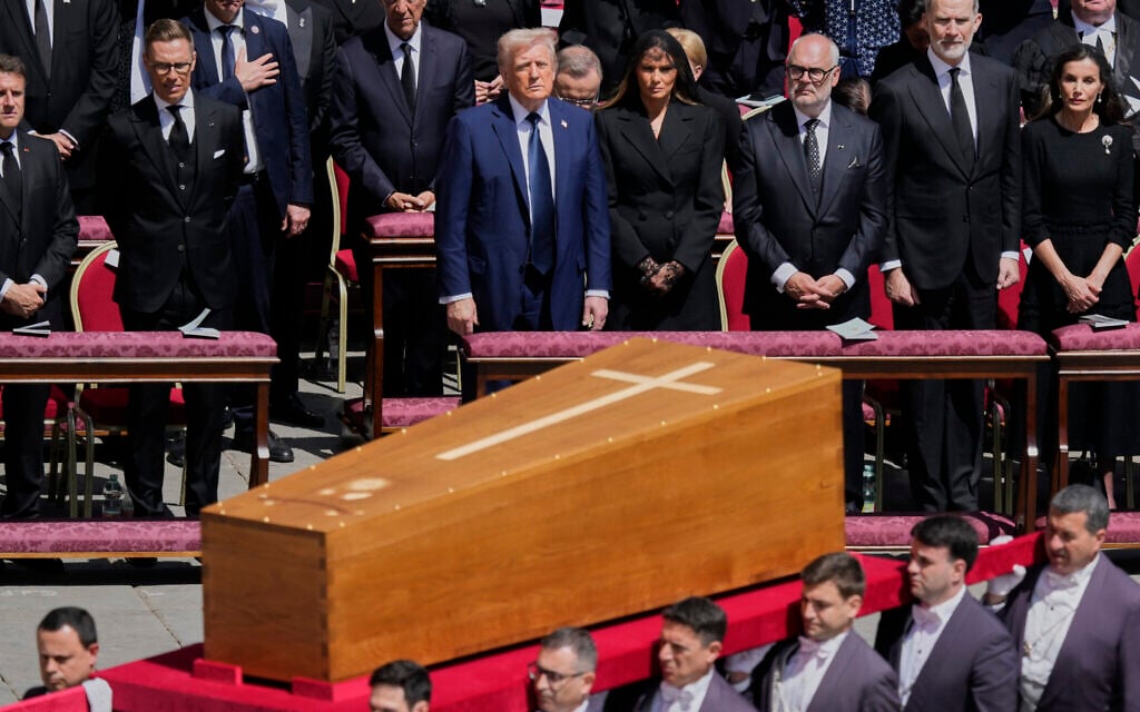 The coffin of Pope Francis is carried in front of dignitaries, including US President Donald Trump, center, during his funeral in St. Peter's Square at the Vatican, April 26, 2025. (AP Photo/Gregorio Borgia)