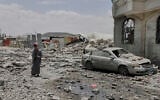 A Yemeni soldier inspects the damage reportedly caused by US airstrikes in Sanaa, Yemen, April 27, 2025. (Osamah Abdulrahman/AP)