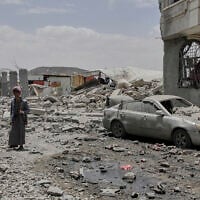 A Yemeni soldier inspects the damage reportedly caused by US airstrikes in Sanaa, Yemen, April 27, 2025. (Osamah Abdulrahman/AP)