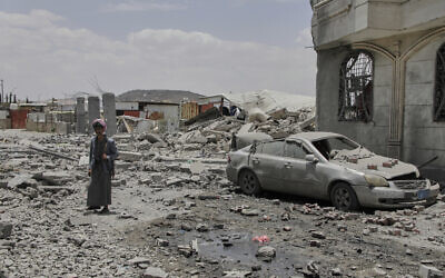 A Yemeni soldier inspects the damage reportedly caused by US airstrikes in Sanaa, Yemen, April 27, 2025. (Osamah Abdulrahman/AP)