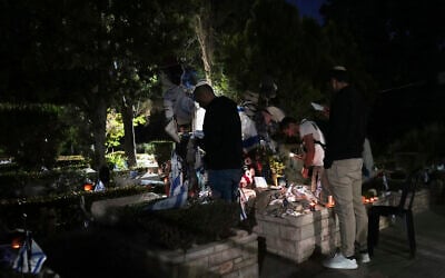 People visit Mount Herzl military cemetery in Jerusalem on the eve of Israel's annual Memorial Day for the fallen soldiers, Tuesday, April 29, 2025. (AP Photo/Ohad Zwigenberg)