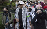 Mohsen Mahdawi, center, looks on during a pro-Palestinian protest at Columbia University, Oct. 12, 2023, in New York. (AP/Yuki Iwamura, File)