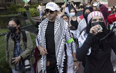 Mohsen Mahdawi, center, looks on during a pro-Palestinian protest at Columbia University, Oct. 12, 2023, in New York. (AP/Yuki Iwamura, File)