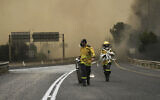 Firefighters work to extinguish a forest fire burning in the Jerusalem hills, April 30, 2025. (AP Photo/Mahmoud Illean)