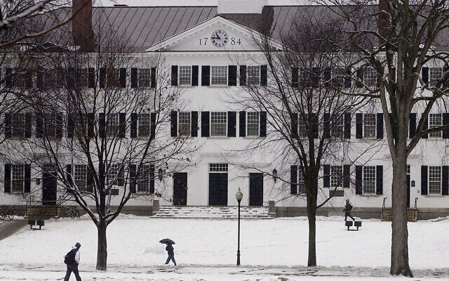 FILE - In this file photo from January 2001, students walk to-and-from classes in front of Dartmouth Hall in Hanover, New Hampshire. (AP Photo/Jim Cole, File) FILE - In this file photo from January 2001, students walk to-and-from classes in front of Dartmouth Hall in Hanover, New Hampshire. (AP Photo/Jim Cole, File)