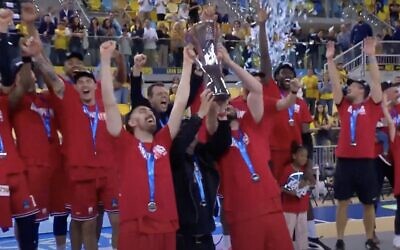 Members of the Hapoel Tel Aviv basketball team celebrate their EuroCup tournament victory, April 11, 2025, after defeating Spanish squad Gran Canaria in the finals. (YouTube screenshot)