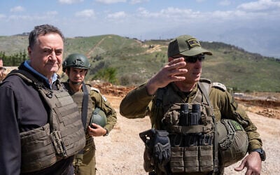 Defense Minister Israel Katz (left) and IDF Northern Command chief Maj. Gen. Ori Gordin (right) are seen at the IDF's Margaliot Defender military post in southern Lebanon, on the outskirts of Markaba, April 2, 2025. (Emanuel Fabian/Times of Israel)