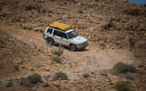 Israeli jeep drivers make their way down a rocky dirt road in the Negev desert, southern Israel, on April 14, 2017. (Hadas Parush/Flash90)