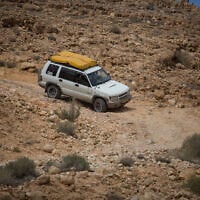 Israeli jeep drivers make their way down a rocky dirt road in the Negev desert, southern Israel, on April 14, 2017. (Hadas Parush/Flash90)