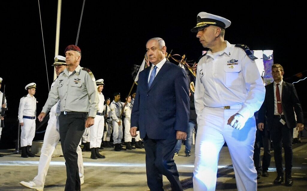Prime Minister Benjamin Netanyahu (C) and IDF Chief of Staff Aviv Kohavi (L) and Navy chief Eli Sharvit (R) arrive at a graduation ceremony for naval officers in Haifa Naval Base, on March 6, 2019. (Meir Vaknin/Flash90)