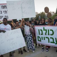 Members of the Hebrew Israelite community protest against deportation orders, at Habima Square in Tel Aviv, June 1, 2021. (Miriam Alster/Flash90)