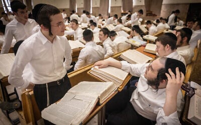 Ultra-Orthodox Jews study at the Ponevezh yeshiva in Bnei Brak, February 27, 2024. (Chaim Goldberg/Flash90)