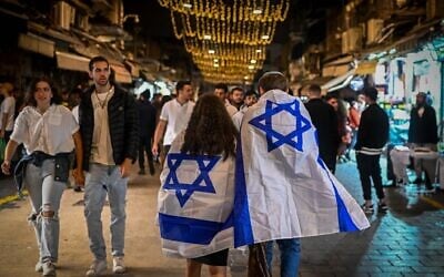 People walk at the Mahaneh Yehudah Market in Jerusalem, during Israel's 76th Independence Day on May 13, 2024. (Arie Leib Abrams/Flash90)