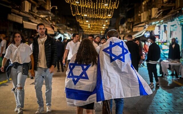 People walk at the Mahaneh Yehudah Market in Jerusalem, during Israel's 76th Independence Day on May 13, 2024. (Arie Leib Abrams/Flash90)