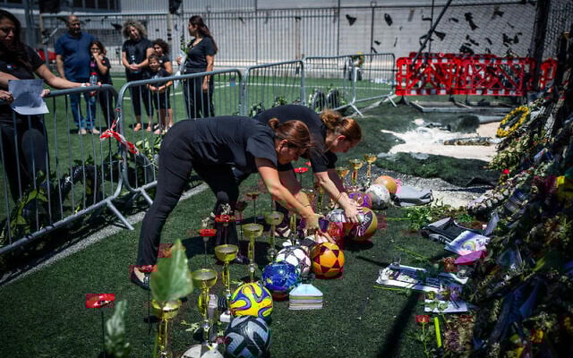 Classmates and teachers of Druze children killed in a deadly missile attack at a soccer field in the Druze village of Majdal Shams, in the Golan Heights, visit the site, August 2, 2024. (Erik Marmor/Flash90) Classmates and teachers of Druze children killed in a deadly missile attack at a soccer field in the Druze village of Majdal Shams, in the Golan Heights, visit the site, August 2, 2024. (Erik Marmor/Flash90)