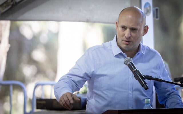 Former prime minister Naftali Bennett speaks at a commemoration marking 30 days since the death of Yona Brif, who was injured fighting invading terrorists during the Hamas onslaught of October 7, 2023, and succumbed to his wounds a year later, at the Mt. Herzal military cemetery in Jerusalem. December 25, 2024. (Chaim Goldberg/Flash90)