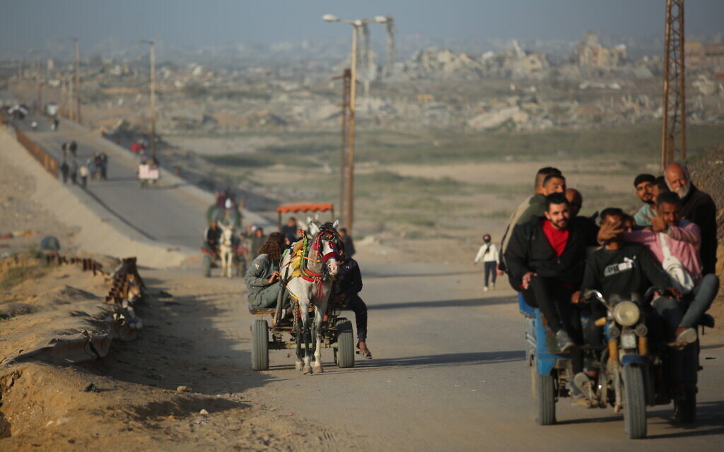 Palestinians seen traveling along Rashid Street after Salah al-Din Street was closed following the resumption of fighting between Israel and Hamas in Gaza, April 2, 2025. (Ali Hassan/Flash90) Palestinians seen traveling along Rashid Street after Salah al-Din Street was closed following the resumption of fighting between Israel and Hamas in Gaza, April 2, 2025. (Ali Hassan/Flash90)