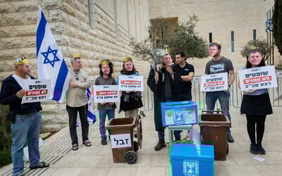 Demonstrators protest against Supreme Court President Isaac Amit outside a court hearing on petitions against the firing of Shin Bet head Ronen Bar, outside the Supreme Court in Jerusalem, April 8, 2025. (Yonatan Sindel/Flash90)