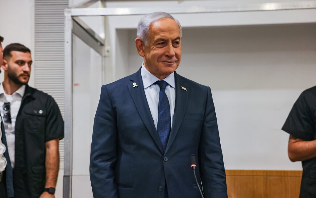 Prime Minister Benjamin Netanyahu arrives at the Tel Aviv District Court to give testimony in his ongoing criminal trial, April 9, 2025. (Miriam Alster/Flash90)