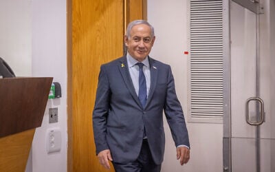 Prime Minister Benjamin Netanyahu arrives at the Tel Aviv District Court for testimony in the corruption trial against him, April 9, 2025. (Miriam Alster/Flash90)