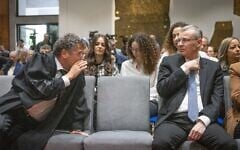 Supreme Court President Isaac Amit (left) speaks to Justice Minister Yariv Levin at the President's Residence in Jerusalem on April 10, 2025. (Chaim Goldberg/Flash90)