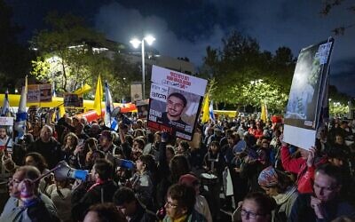 Families of Israelis held hostage in Gaza and their supporters protest outside the home of Strategic Affairs Minister Ron Dermer in Jerusalem on April 13, 2025. (Chaim Goldberg/Flash90)