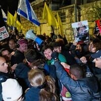 Demonstrators calling for a hostage deal clash with police during a protest outside the home of Strategic Affairs Minister Ron Dermer in Jerusalem on April 13, 2025. (Chaim Goldberg/Flash90)