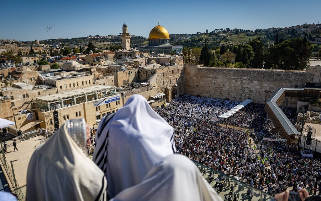 Jewish worshipers pray at and near the Western Wall in Jerusalem's Old City, during the Priestly Blessing pilgrimage during the Jewish festival of Passover, April 17, 2025. (Chaim Goldberg/Flash90)