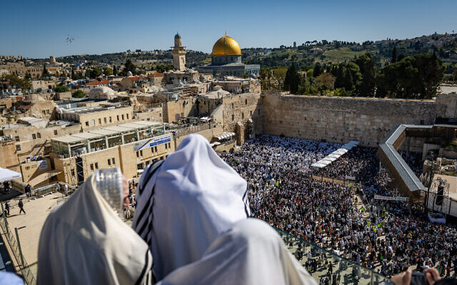 Jewish worshipers pray at and near the Western Wall in Jerusalem's Old City, during the Priestly Blessing pilgrimage during the Jewish festival of Passover, April 17, 2025. (Chaim Goldberg/Flash90)