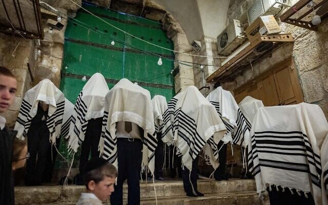 Orthodox Jews pray outside the Temple Mount, in the Muslim Quarter of Jerusalem's Old City, during the Passover holiday, April 17, 2025. (Chaim Goldberg/Flash90)