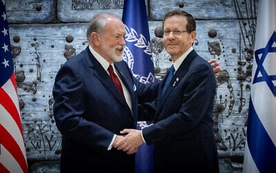 US Ambassador to Israel Mike Huckabee embraces President Isaac Herzog after presenting his credentials, at the President's Residence in Jerusalem, April 21, 2025. (Chaim Goldberg/Flash90)