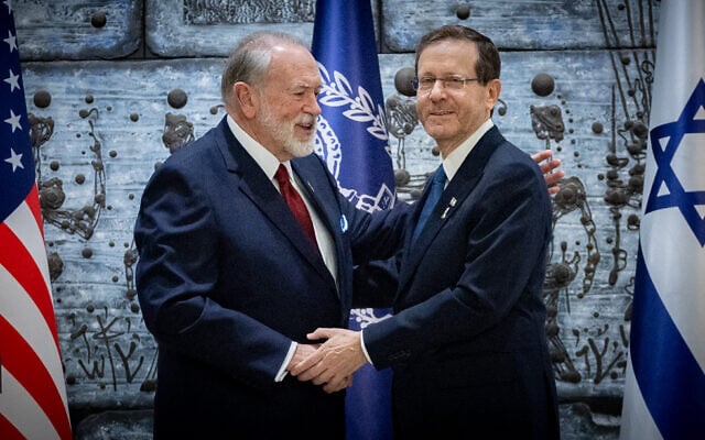 US Ambassador to Israel Mike Huckabee embraces President Isaac Herzog after presenting his credentials, at the President's Residence in Jerusalem, April 21, 2025. (Chaim Goldberg/Flash90)
