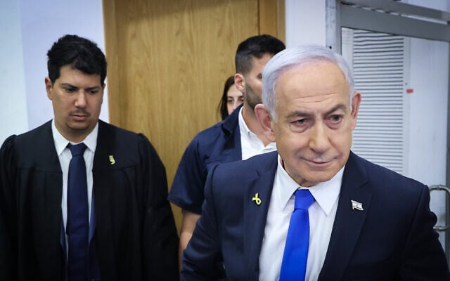 Prime Minister Benjamin Netanyahu arrives at the District Court in Tel Aviv, before the start of his testimony in the corruption trial against him, April 21, 2025. (Moti Kimchi/POOL)