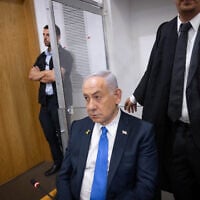 Prime Minister Benjamin Netanyahu at the courtroom in the Tel Aviv District Court before the start of a hearing in his trial, April 22, 2025 (Miriam Alster/Flash90)