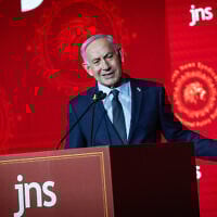 Prime Minister Benjamin Netanyahu speaks at the Jewish News Syndicate conference in Jerusalem, on April 27, 2025. (Yonatan Sindel/Flash90)