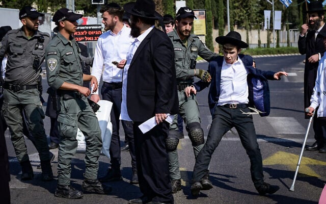 Protesters clash with police during a demonstration against Haredi conscription into the IDF, outside the recruitment center at Tel Hashomer, in central Israel, on April 28, 2025 (Avshalom Sassoni/Flash90) Protesters clash with police during a demonstration against Haredi conscription into the IDF, outside the recruitment center at Tel Hashomer, in central Israel, on April 28, 2025 (Avshalom Sassoni/Flash90)