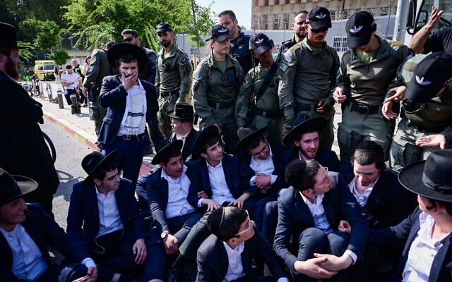 Ultra-Orthodox protesters block the street outside the IDF Recruitment Center at Tel Hashomer, April 28, 2025. (Avshalom Sassoni/Flash90) Ultra-Orthodox protesters block the street outside the IDF Recruitment Center at Tel Hashomer, April 28, 2025. (Avshalom Sassoni/Flash90)