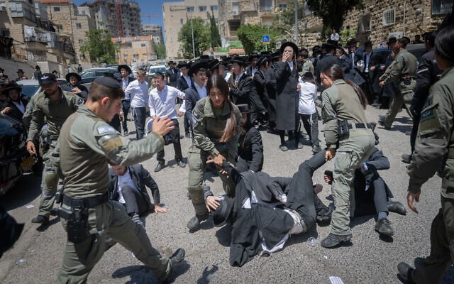 Ultra-Orthodox men protest the IDF draft outside the Jerusalem enlistment center, April 28, 2025 (Chaim Goldberg/Flash90) Ultra-Orthodox men protest the IDF draft outside the Jerusalem enlistment center, April 28, 2025 (Chaim Goldberg/Flash90)