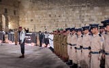 Israeli soldiers stand still as the memorial siren sounds during the ceremony marking Memorial Day for Israel's fallen soldiers and victims of terror, at the Western Wall in Jerusalem's Old City, on April 29, 2025. (Chaim Goldberg/Flash90)