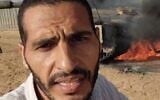 Journalist and alleged Hamas operative Hassan Eslaiah is seen in front of a burning IDF tank during the October 7, 2023, onslaught. (Screenshot: X; used in accordance with Clause 27a of the Copyright Law)