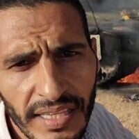 Freelance journalist Hassan Eslaiah, whom the IDF has indentifed as a member of the Hamas terror group's Khan Younis Brigade, is seen in front of a burning IDF tank during the October 7, 2023, onslaught. (Screenshot: X; used in accordance with Clause 27a of the Copyright Law)