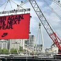 A temporary billboard displayed by Nike, meant to inspire runners in the 2025 London Marathon, reads 'Never again. Until next year,' April 27, 2025. (Via X via JTA)
