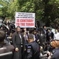 Ultra-Orthodox Jews protest the IDF draft outside the Jerusalem enlistment center, April 28, 2025. (Sam Sokol/Times of Israel)
