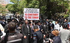 Ultra-Orthodox Jews protest the IDF draft outside the Jerusalem enlistment center, April 28, 2025. (Sam Sokol/Times of Israel)
